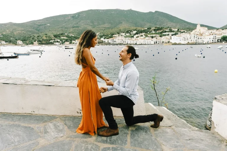 Marriage proposal on one knee by the sea in the picturesque town of Cadaqués.