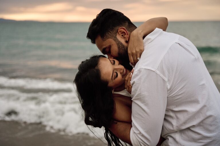 Intimate eye contact between a couple during their Barcelona proposal photoshoot at dawn.