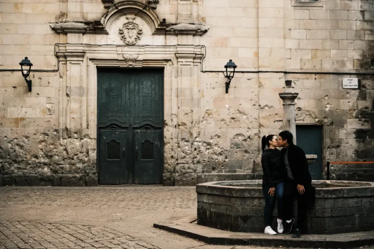Candid photo of a kiss at Sant Felip Neri