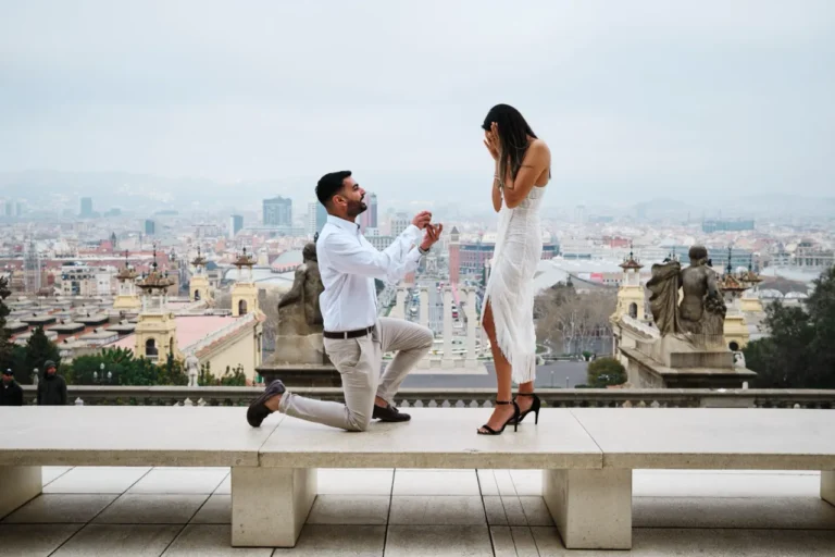 Marriage proposal on one knee with the stunning Barcelona city skyline view from MNAC.