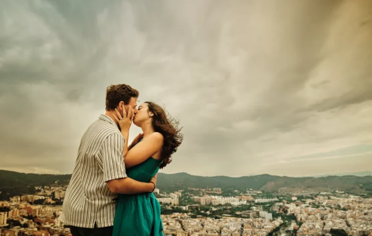 Tender couple moment during an engagement photoshoot at the Bunkers del Carmel viewpoint.