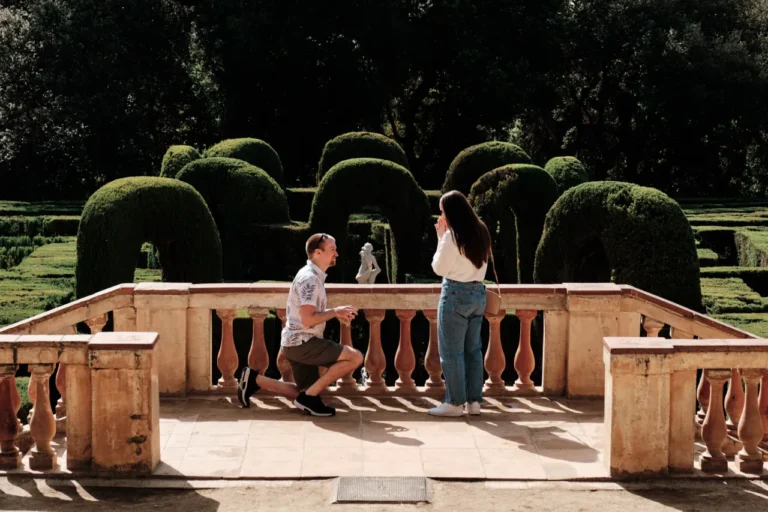 Romantic proposal scene at the classical balustrades of the historic Horta gardens.