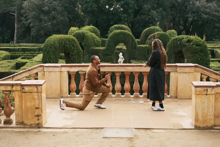 Emotional proposal moment at the Horta Labyrinth Park with the cypress maze in the background.