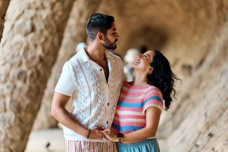 Romantic engagement portrait featuring the unique Gaudí architecture at Park Güell.