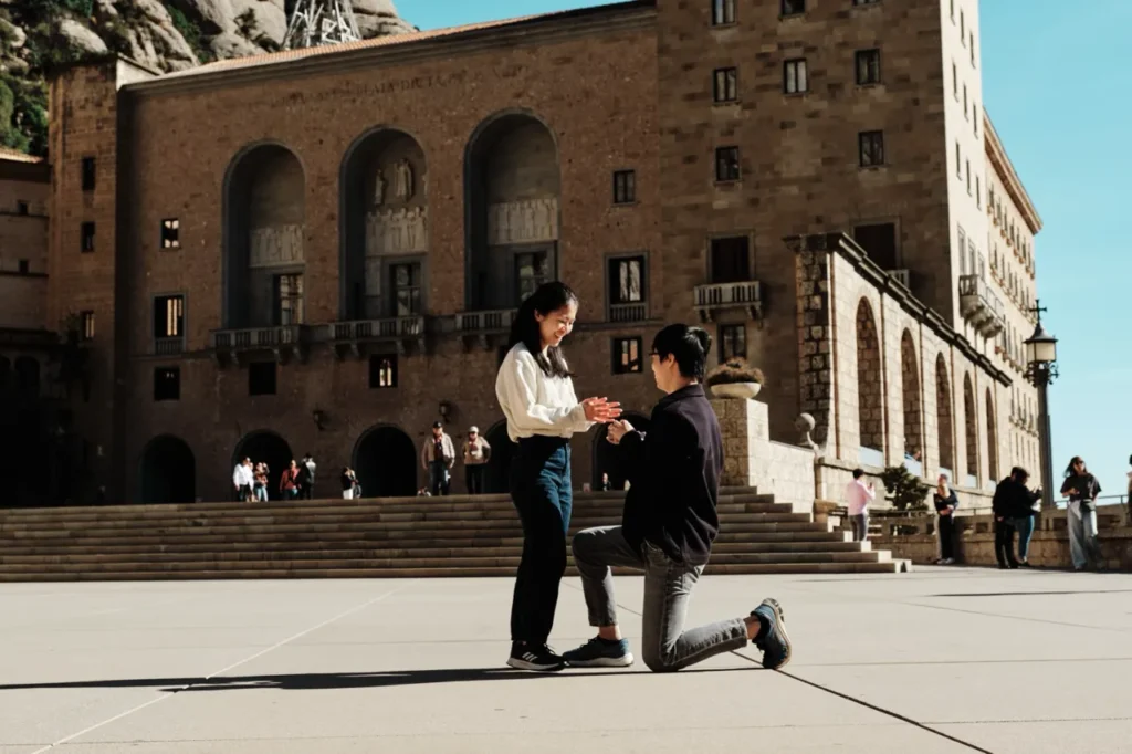 Marriage proposal on one knee at the scenic Montserrat mountain lookout.