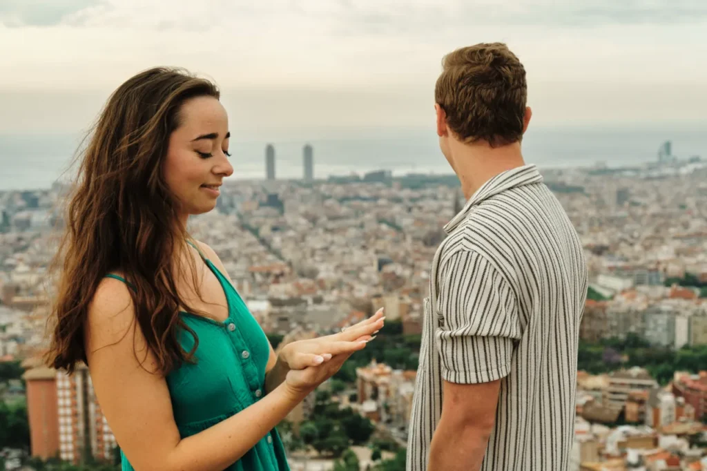Emotional proposal moment at Bunkers del Carmel with panoramic Barcelona views.
