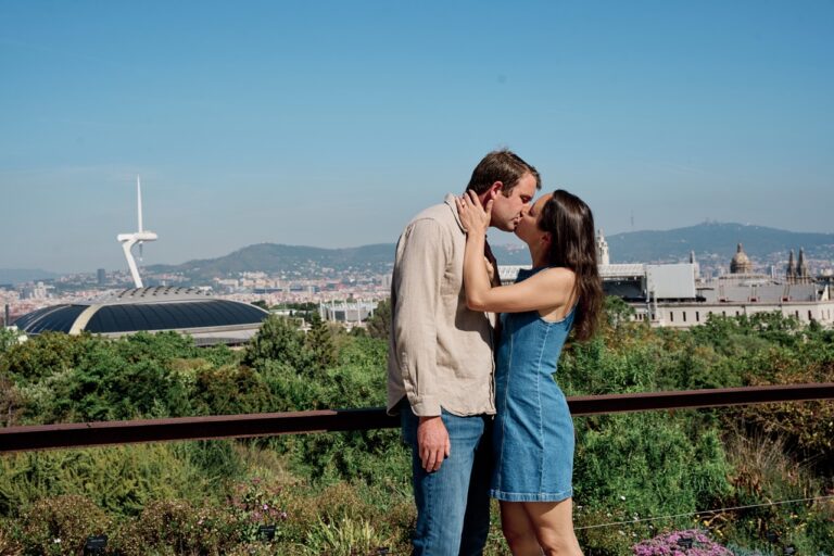 Young couple kissing celebrating proposal in barcelona