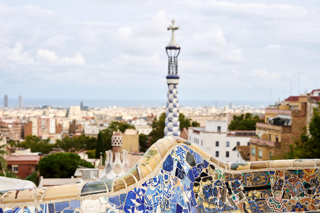 The trencadís mosaic bench at Plaça de la Natura in Park Güell, looking out over Barcelona